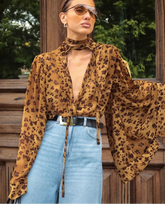 Animal print lace v-neck blouse styled as a statement city top